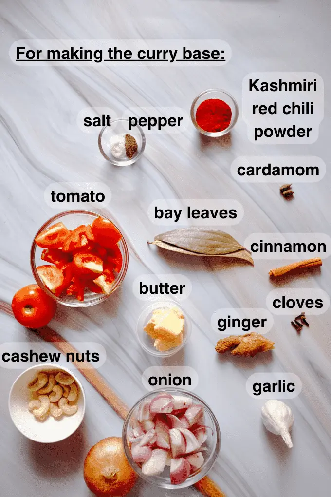 Ingredients needed to make the Butteriest Scrumptious Butter Chicken curry base like Kashmiri red chili powder, salt, black pepper, tomato, bay leaves, cardamom, butter, cinnamon, cloves, cashew nuts, onion, ginger and garlic