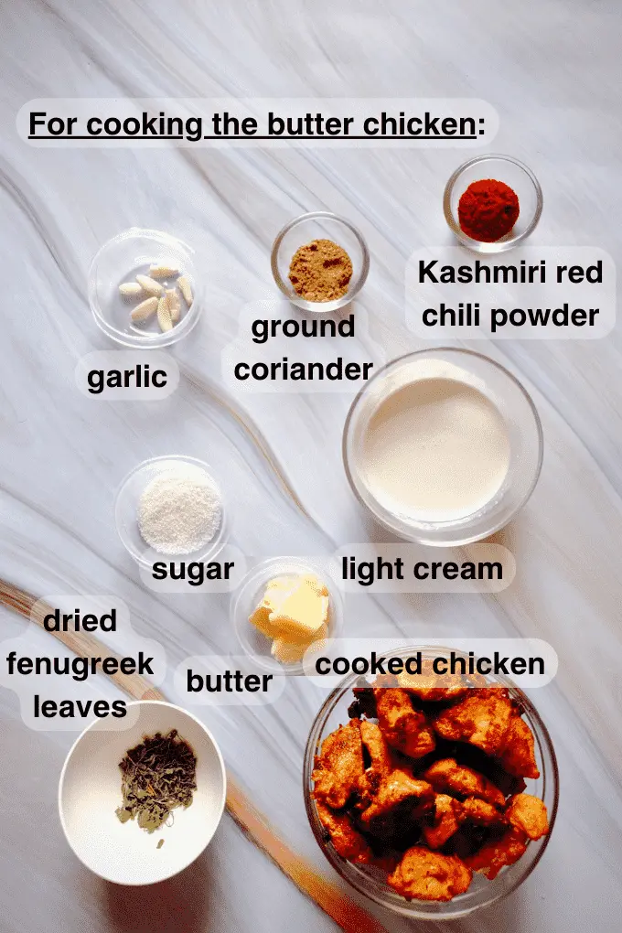 Ingredients needed to complete cooking the butter chicken curry like garlic, ground coriander, Kashmiri red chili powder, light cream, sugar, butter, dried fenugreek leaves and cooked chicken